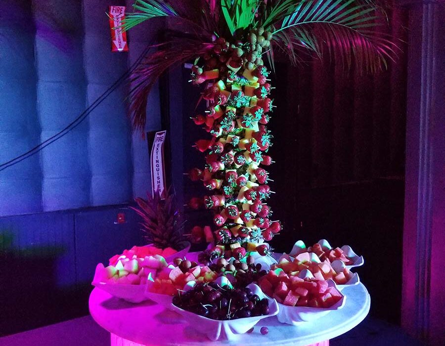 A palm tree with fruit on top of it.