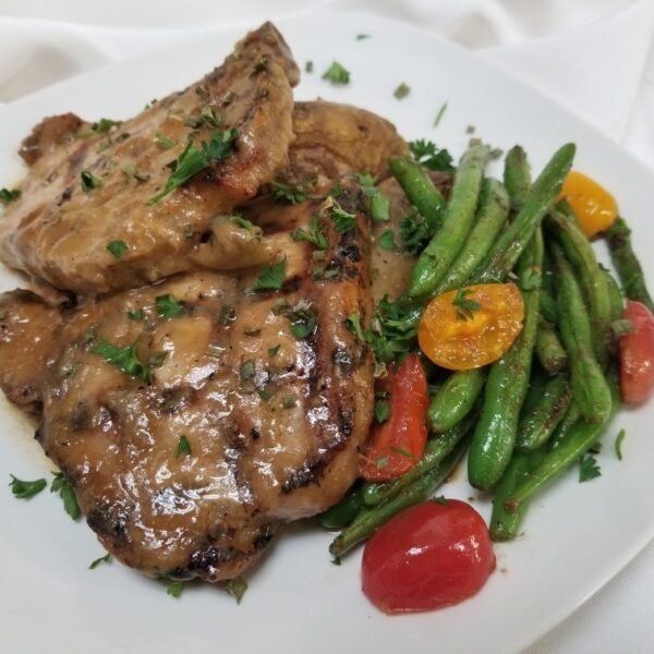 Smothered pork chops with vegetables