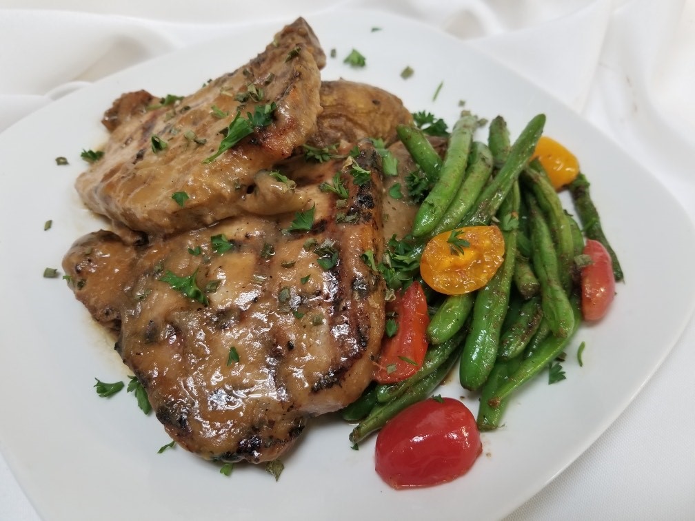 Smothered pork chops with vegetables